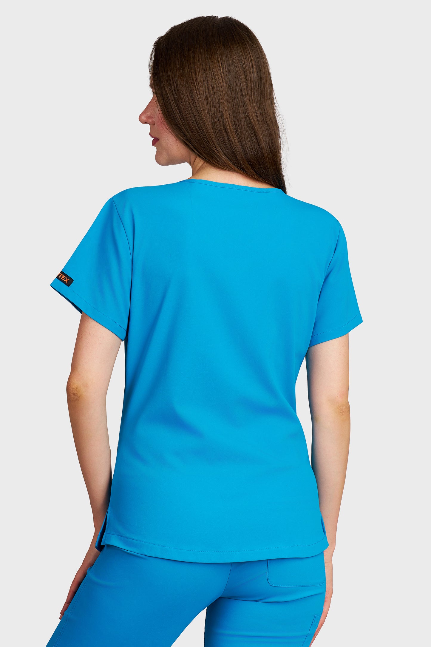 Bluza medicala femei Carmen turcoaz stretch - vedere din spate - AKITEX