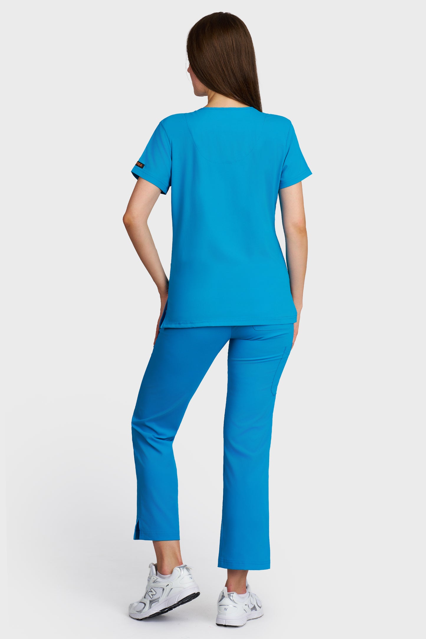 Costum medical femei turquoise - bluza medicala Tosca si pantaloni Violeta, vedere din spate - AKITEX