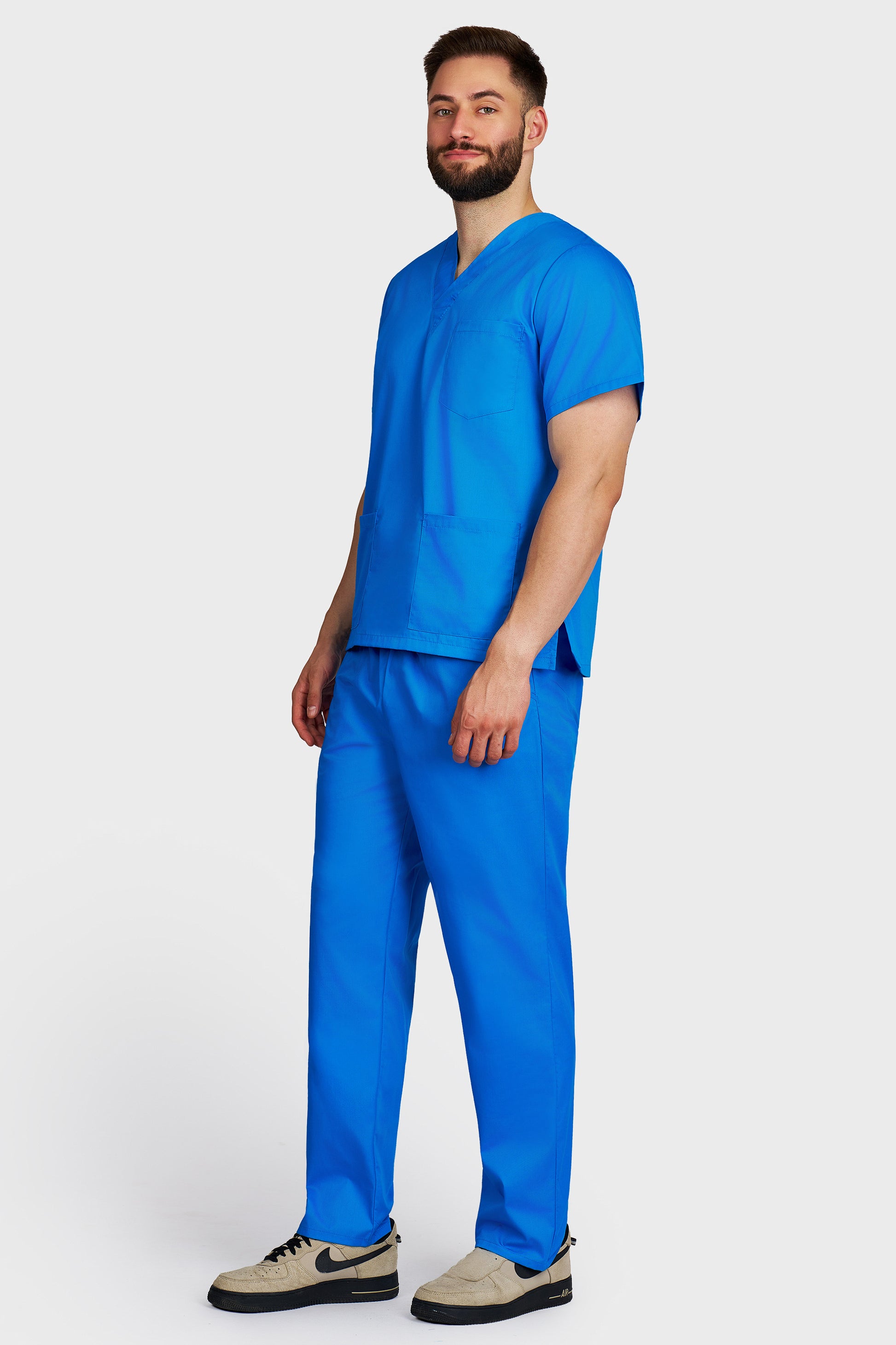Costum medical barbati turquoise - bluza medicala cu guler in V si pantaloni cu elastic si snur, vedere laterala - AKITEX